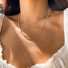 D E T A I L S • Single Beaded Chain• 18k Gold Filled• Length: 20" M A T E R I A L S •Our Gold filled jewelry has an outer layer of 14k or 18k gold that is pressure bonded to a base metal of jewelers brass or sterling silver. •This type of jewelry is made for everyday use of stacking or layering. • This type of jewelry can withstand normal body sweat, body oils, and is typically water resistant. J E W E L R Y C A R E Take extra care of your new jewelry to maximize its lifespan: •Try to avoid cont Double Strand Beaded Chain Necklace, Delicate Double Strand Layered Necklace With Satellite Chain, Dainty Beaded Chain Necklaces For Layering, Dainty Beaded Chain Necklace For Layering, Everyday Double Strand Beaded Chain Necklace, Delicate Beaded Chain Layered Necklace, Minimalist Beaded Chain Layered Necklace, Dainty Beaded Chain Layered Necklace, Minimalist Everyday Beaded Chain Layered Necklace