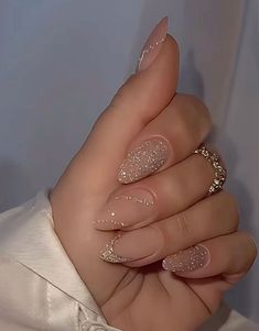 Bridesmaid Almond Nails, Nude Party Nails, Almond Shimmer Nails, New Years Acrylic Nails Sparkle, Holiday Nails Almond Shape Sparkle, Nude Engagement Nails, Nye 2024 Nails, Short Winter Nails Acrylic, Glittery Tips Nails