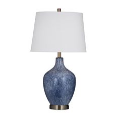 a blue lamp with a white shade on it