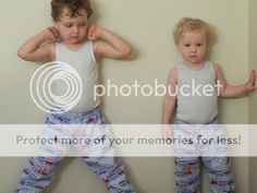 two young boys standing next to each other wearing matching pants and vests with the words protect more of your memories for less