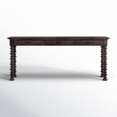 an old wooden table with two drawers on one side and beaded legs on the other