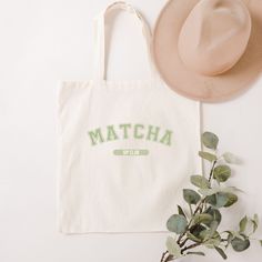 "Carry your love for Matcha wherever you go with our Canvas Tote Bag. Made for Matcha enthusiasts and matcha latte lovers in mind, it's made from durable cotton canvas, great for everyday use or as a reusable grocery bag. With its spacious size and sturdy construction, it's ideal for shopping trips, visits to the market, or for gifting. Embrace your canine companion and add a touch of style and functionality to your outings with this versatile tote bag. ❤ 100% cotton canvas durable and perfect for everyday wear.  ❤ Heavy fabric (12 oz/yd² (406.9 g/m ❤ Width:15\" Length: 16\"  ❤ 20\" handles CARE INSTRUCTIONS: * Turn inside out * Machine wash: Cold (max 30C or 90F) * Non-chlorine: bleach as needed * Tumble dry: low heat * Do not iron directly over the printed area  Please note colors may ap Personalized Green Bags For Daily Use, Green Canvas Bag With Letter Print For Everyday, Green Bag With Letter Print For Gift, Green Letter Print Bags As Gifts, Trendy Green Canvas Bag Gift, Trendy Green Canvas Bag For Gift, Eco-friendly Green Bag With Letter Print, Eco-friendly Green Bags With Letter Print, Matcha Bar