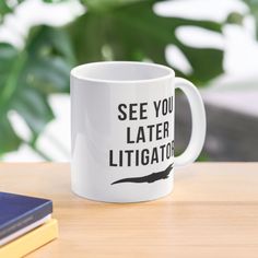 a white coffee mug with the words see you later litigator printed on it