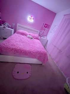 a hello kitty bedroom with pink walls and carpet