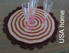 three wine glasses sitting on top of a placemat