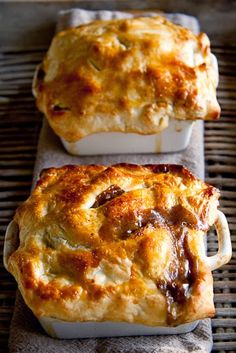 two square casseroles sitting on top of a table