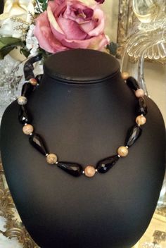 "One strand faceted black onyx and faceted crazy agate necklace. This necklace measures 20\" long. The black onyx tube faceted bead is 1 1/4\" long. The necklace and stones are beautiful. Looks great with any outfit. If you like it \" pin it \"." Black Onyx Necklace With Gemstone Beads, Black Onyx Beaded Necklace With Faceted Beads, Black Onyx Crystal Necklace With Black Beads, Black Onyx Necklaces With Faceted Beads, Black Onyx Necklace With Faceted Beads, Black Obsidian Necklace With Natural Stones, Onyx Faceted Round Beads Jewelry, Onyx Jewelry With Faceted Round Beads, Black Onyx Round Bead Crystal Necklaces