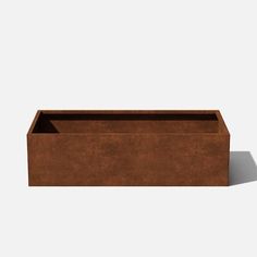 a brown rectangular planter sitting on top of a white wall