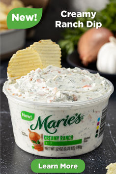 a bowl of ranch dip with crackers on the side and text overlay reading new creamy ranch dip