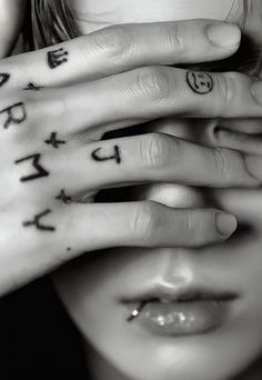 a woman with her hands on her face covered by the word love written in cursive writing