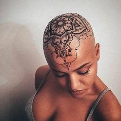 a woman with a tattoo on her head