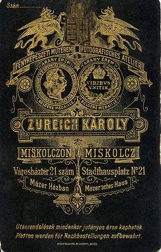 an old concert poster from the early 1900's, with gold lettering on black paper