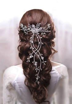 the back of a woman's head wearing a bridal hair comb