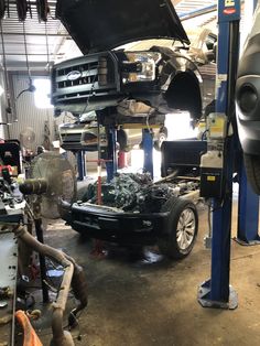 a car being worked on in a garage