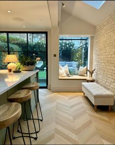 a living room filled with furniture next to a window