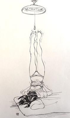 a black and white drawing of a person laying on the ground with an object above their head