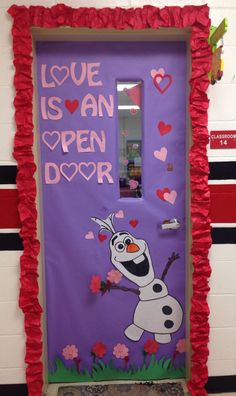 a door decorated with the words love is an open door and a frozen princess character