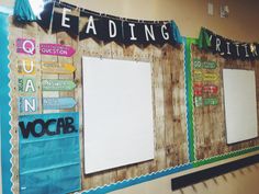 a bulletin board with writing on it and some paper hanging from the wall behind it