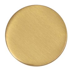 an image of a gold colored metal disc