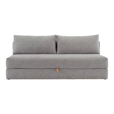 a gray couch with two pillows on it's back and one arm folded up