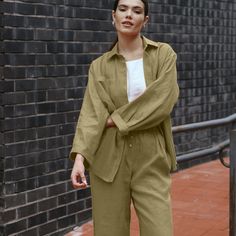 This simple yet stylish Linen Pant Set in Laurel Green, featuring an oversized Linen shirt and wide-leg Linen pants, is perfect for those who value both comfort and elegance. Perfect for outings, relaxed days at home, and ideal for resort wear. DETAILS SHIRT ⚬ Pointed collar. ⚬ Button-front closure. ⚬ Chest pocket. ⚬ Drop shoulders. ⚬ Cuffed bracelet-length sleeves. ⚬ Made of organic Oeko-Tex-certified linen. ⚬ The linen is NOT see-through. ⚬ Shown here in Laurel Green. Video in Red Terracotta P Terracotta Pants, Linen Pant Set, Green Video, Summer Co Ords, Laurel Green, Oversized Linen Shirt, Linen Pant, Traditional Clothes, Wide Leg Linen Pants