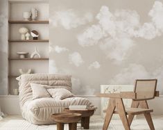 a living room filled with furniture and walls covered in clouds