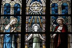 the stained glass window depicts mary and jesus