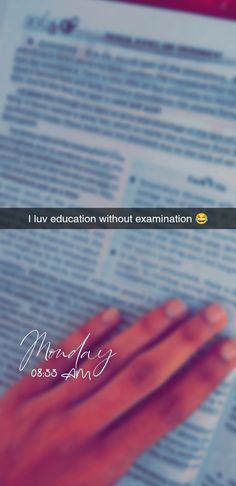 a person holding their hand on top of a piece of paper with the words, i luv education without examination