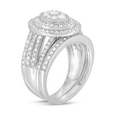 Give her a stunning symbol of your love with this vintage-inspired diamond bridal set. Fashioned in cool 10K white gold, the outstanding engagement ring features an oval-shaped composite of diamonds - the largest a 1/10 ct. stone - wrapped in double frame of diamonds and intricate milgrain. The split multi-row shank shimmers with diamonds and milgrain borders. Seal your vows with the coordinating diamond- and milgrain-lined wedding band. Captivating with 1-1/4 cts. t.w. of diamonds and a bright polished shine, this bridal set is destined to be treasured. Center Stone Engagement Ring, Double Frame, Peoples Jewellers, Diamond Bridal Sets, Stone Wrapping, Stone Engagement Rings, Jewelry Repair, Bridal Set, Vintage Diamond