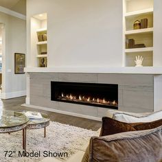 a living room with a fire place in the center