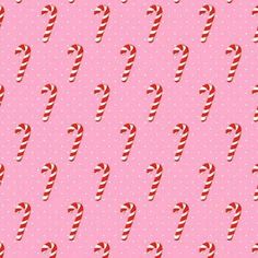 candy canes on pink background with polka dotty fabric for wallpaper or backdrop