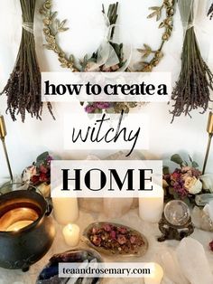 how to create a witchy home with candles, herbs and other items on the table