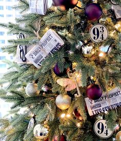 a decorated christmas tree with newspaper and ornaments