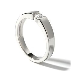 a white gold ring with a single diamond