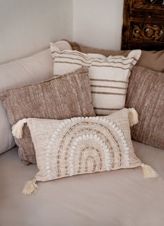 pillows are arranged on the couch in this living room