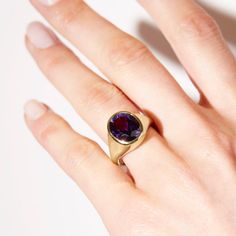 Take your style to a higher level with the magnificent Aphrodite statement ring featuring an oval amethyst made with Fairmined 18k yellow gold by Chroma. • Fairmined 14k yellow gold • 4.90ct Oval Amethyst • Band Width: 2mm - 6mm • In stock in size 6. This ring is able to be resized, please allow 4 weeks. Designed and crafted by us in NYC using recycled gold, conflict-free diamonds and responsibly sourced gemstones. The Fairmined program certifies gold created by small scale mining organizations, Oval Amethyst Ring In Yellow Gold With Polished Finish, Oval Yellow Gold Amethyst Ring With Polished Finish, Timeless Gold Amethyst Ring, Timeless Yellow Gold Amethyst Ring With Oval Shape, Modern Gold Amethyst Gemstone Ring, Elegant Purple Amethyst Signet Ring, Timeless Gold Oval Amethyst Ring, Timeless Oval Gold Amethyst Ring, Elegant Amethyst Gemstone Signet Ring