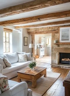 a living room filled with furniture and a fire place