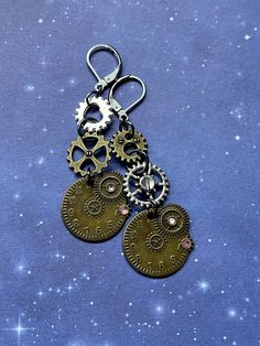 These super cute Victorian future time travel princess, mixed metal earrings are super adorable.  They have so much detail and uniqueness to them.  The Leverback is 100% stainless steel. Perfect gift for yourself or your favorite steam punk princess friend!  I made  this adorable line of steampunk cuties into six uniquely designed styles! I hope you love them all ⚙️♥️✨ Personalized Bronze Metal Jewelry, Nickel-free Themed Stainless Steel Jewelry, Themed Nickel-free Stainless Steel Jewelry, Steampunk Silver Dangle Jewelry, Steampunk Style Dangle Jewelry, Steampunk Silver Earrings, Steampunk Dangle Earrings For Pierced Ears, Gold Steampunk Nickel-free Jewelry, Silver Steampunk Dangle Jewelry