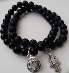 Set of 2 Ohm OM Hamsa Hand Evil Eye Obsidian Lava Stretch Spirit Bead Bracelet #MayaBracelets #BohoBraceletBuddhaBeadsChakraBraceletSpiritualHealingCrystalBeadedCharm Hand Evil Eye, Om Yoga, Healing Therapy, Christmas Hanukkah, Hamsa Hand, Ideas Christmas, Eye Black, Yoga Meditation, Bead Bracelet