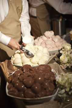 a person is serving food at a buffet