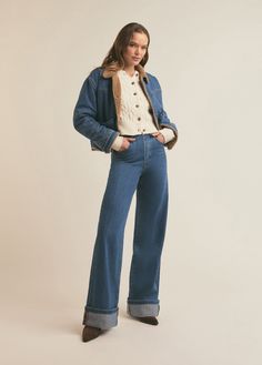 The stonewashed medium blue denim of The Bridget Crop Jacket has cool, vintage vibes thanks to the tan shearling lining, pointed collar and dropped front and back yoke. It has a slightly cropped length and features seam details and low, slanted front pockets for true retro vibes. 91% Cotton, 9% Recycled Cotton Zo is 5'10" wearing size small. Denim Outerwear With Corduroy Collar For Fall, Fall Denim Outerwear With Corduroy Collar, Vintage Denim Jeans For Winter, Retro Medium Wash Outerwear For Fall, Retro Denim Winter Outerwear, Retro Medium Wash Outerwear For Winter, Retro Denim Blue Outerwear For Fall, Retro Medium Wash Winter Outerwear, Denim Blue Cropped Denim Jacket For Winter