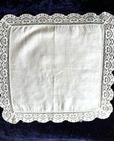 an old white cloth with lace on it