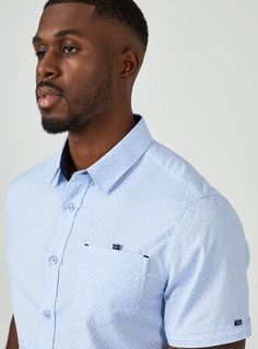 Smiling is easy in this stretch premium cotton short sleeve shirts. The geometric pattern stands out without being busy; while the 7DIAMONDS signature details elevate the style. Details Model is 6'1" and wears a size medium. Care: Machine wash cold on delicate cycle, low tumble dry, do not iron Composition: 50% Cotton/ 46% Polyester/ 4% Spandex Light Blue Casual Shirt For Semi-formal Occasions, Light Blue Short Sleeve Shirt For Business Casual, Short Sleeve Button Up, Rhodes, Lifestyle Brands, Cotton Shorts, Stretch Cotton, Short Sleeve Shirt, Light In The Dark