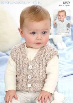 a baby sitting on top of a bed wearing a sweater