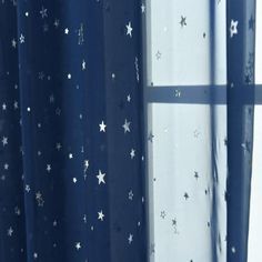 the curtain is open and there are stars on it