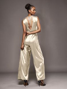 This soft satin jumpsuit features a flattering v-neck design, making it the perfect choice for mothers of the bride. Its dress pantsuit style provides comfort and elegance, while its high-quality material ensures a polished look. Stay stylish and comfortable on that special day with our jumpsuit. Dress Pantsuit, Wedding Guest Men, Mother Of The Groom Dress, Satin Jumpsuit, Dress Pant Suit, Junior Bridesmaid Dresses, Junior Bridesmaid, Mother Of The Bride Dress, Stretch Satin