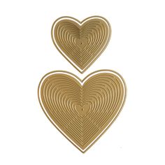 two gold heart shaped magnets on a white background