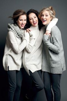 three women in sweaters posing for the camera