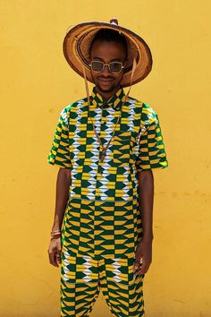 Stand out in our yellow and green Kente short sleeve men's shirt. Made from soft cotton, this bold and vibrant print is perfect for a carnival outfit. Pair it with matching shorts for the ultimate festival look.  - African print men's shirt - Tailored fit - Small collar - 100% cotton   - Buttoned front - Left breast pocket - Matching shorts and hats available THE CREATOR Francis Opoku  SIZE S - Chest 40" M - Chest 42-44" L - Chest 44-46" XL - Chest 46-49" ABOUT US Social responsibility is at the Jamaica Shirt, Carnival Outfit, Tropical Top, Festival Outfits Men, Yellow Shirt, Festival Clothing, Yellow Shirts, Mens Boardshorts, Festival Looks