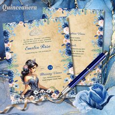 a blue and white wedding stationery with flowers on it, including a pen and paper